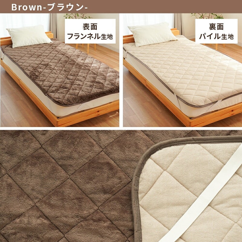 敷きパッドの品質表示タグ（サイズ100×205cm、ポリエステル100％・パイル糸綿100％、中国製、西川株式会社）とお取り扱い方法アイコン
